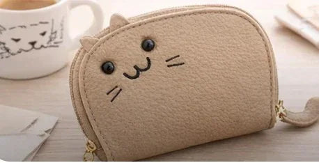 Handcrafted tan cat-shaped leather cardholder with a cute whiskered face and secure gold zipper