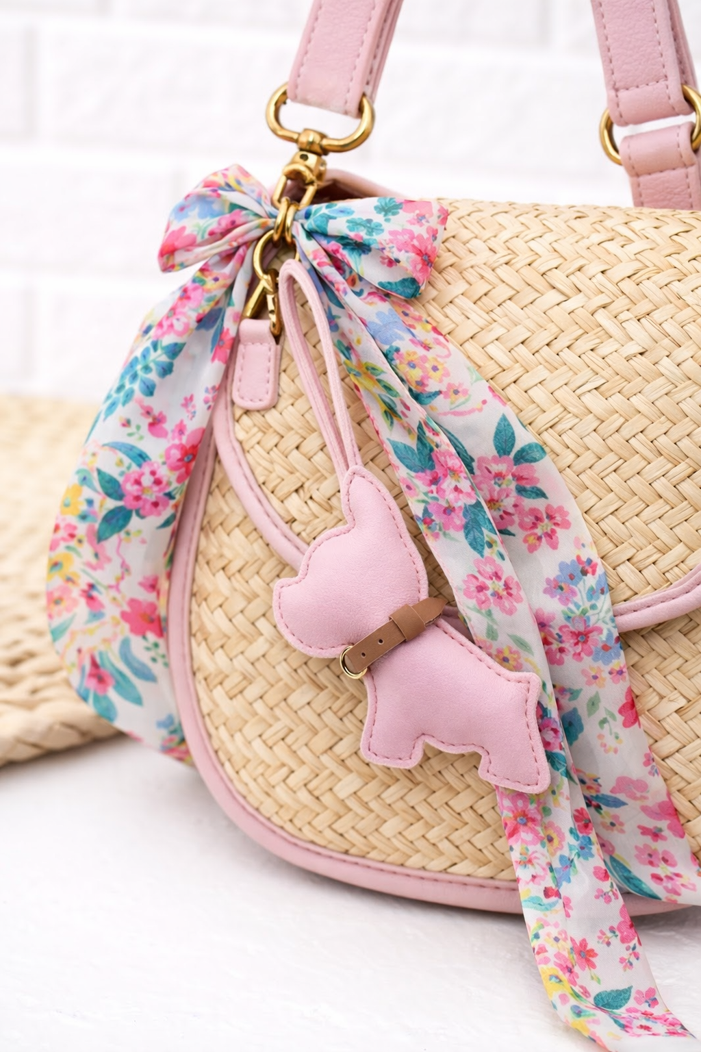 White Pocket Puppy Leather Bag Charm  with collar on a straw  purse with scarf. 