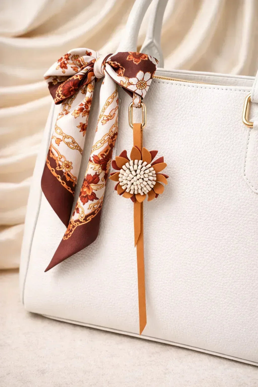 White Autumn Rosette Charm on white  purse with scarf. 