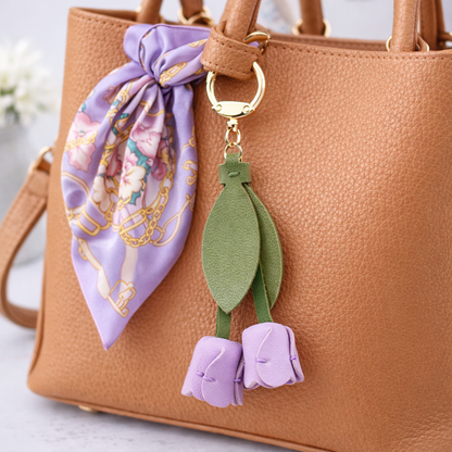 Blue  Sweetheart Tulip Bag Charm with key ring on purse with scarf. 