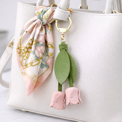 White Sweetheart Tulip Bag Charm with key ring on purse with scarf. 