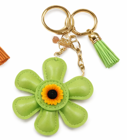 Handmade green  leather daisy keychain with yellow center and gold clasp.