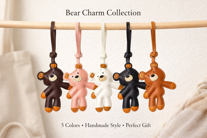 Collection of bear-shaped leather bag charms in various colors hanging on a stick.