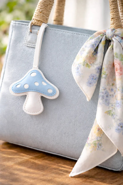 Lavender Meadow Mushroom – Handmade Leather Mushroom Bag Charm on luxury bag with scarf. 