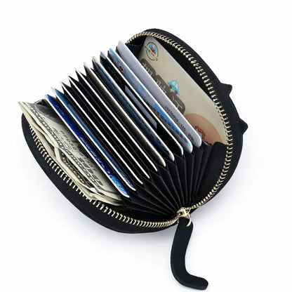 Inside view of the cat card wallet showing thre card slots and a separate pocket for coins.