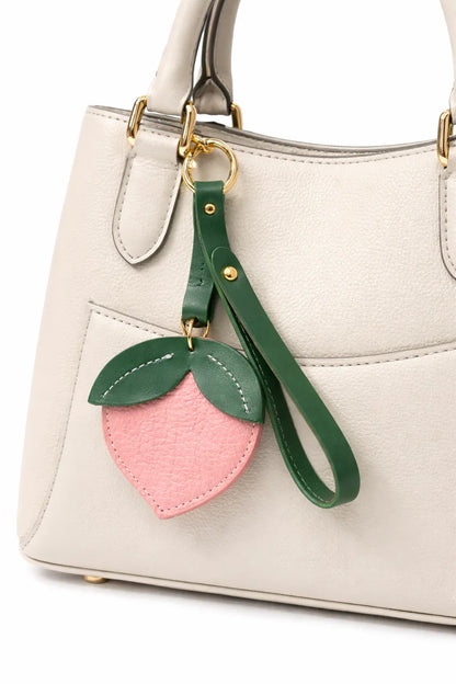 Little Orchard Peach Fruit Bag Charm with leather strap on Purse. 