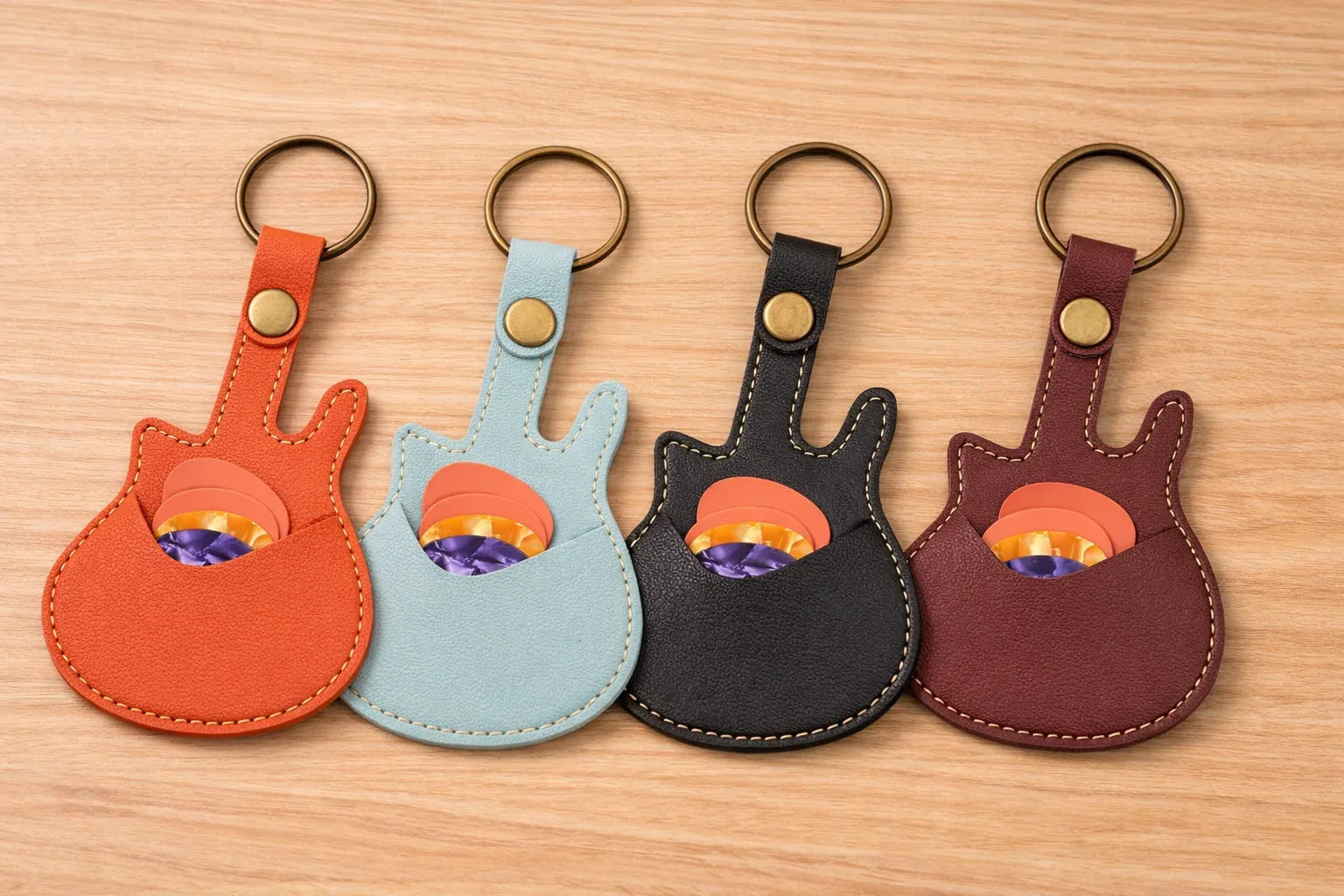 4 Handmade guitar-shaped leather keychain with a secure pick pocket and brass-tone ring with picks inside pouch.