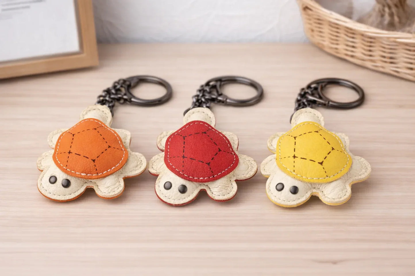 3 Leather Turtle Key Chains  with key ring on table