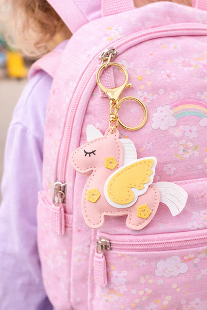 Dreamy pink Unicorn Keychain  with key ring and clasp on a pink backpack. 
