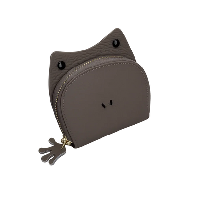 Handcrafted green leather frog-shaped card holder with a smiling face and gold zipper.