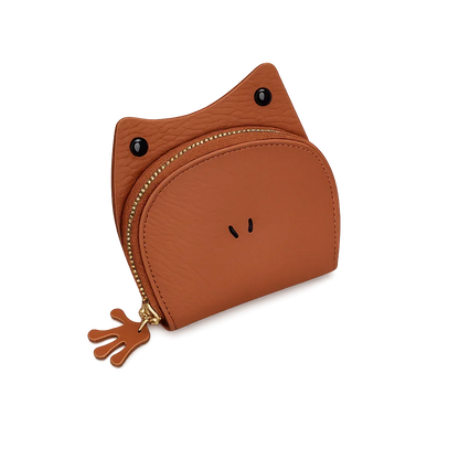 Handcrafted brown leather frog-shaped card holder with a smiling face and gold zipper.