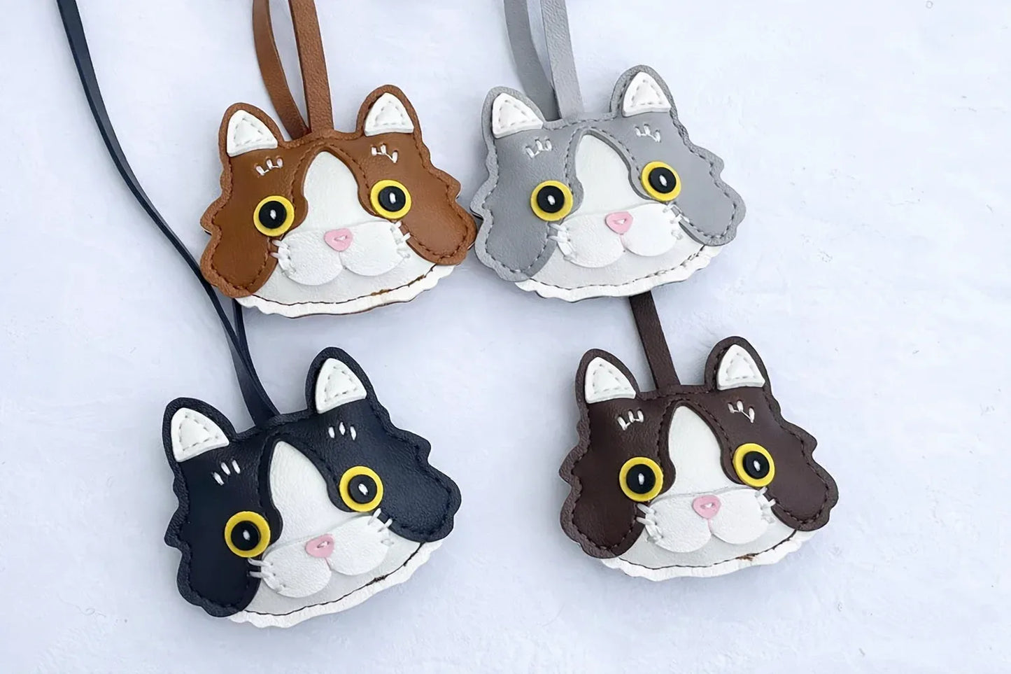 4 Whiskered Heirloom Leather Cat Charms.