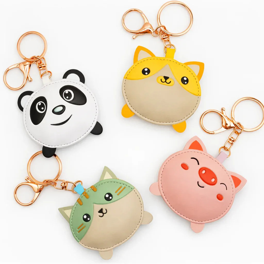 4 cute puddle pals with key ring and clasp on table. Panda, Pig, Cat, Dog