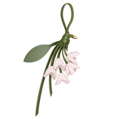 White Petite Lily Bag Charm  with leather strap. 