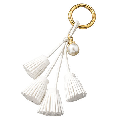 White Suede & Pearl Tassel Bag Charm with pearl accent on brass key ring. 
