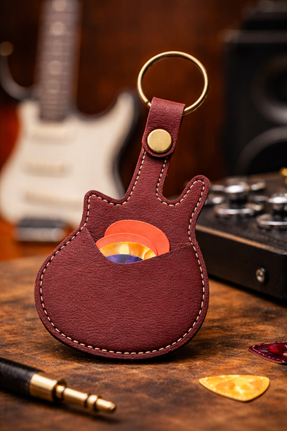 Handmade brown  guitar-shaped leather keychain with a secure pick pocket and brass-tone ring.