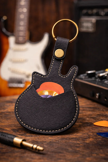 Handmade black guitar-shaped leather keychain with a secure pick pocket and brass-tone ring.