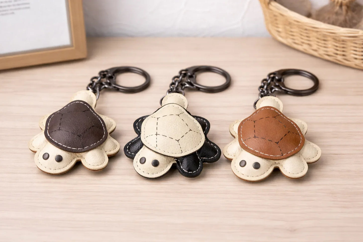 3 Leather Turtle Key Chains  with key ring on table