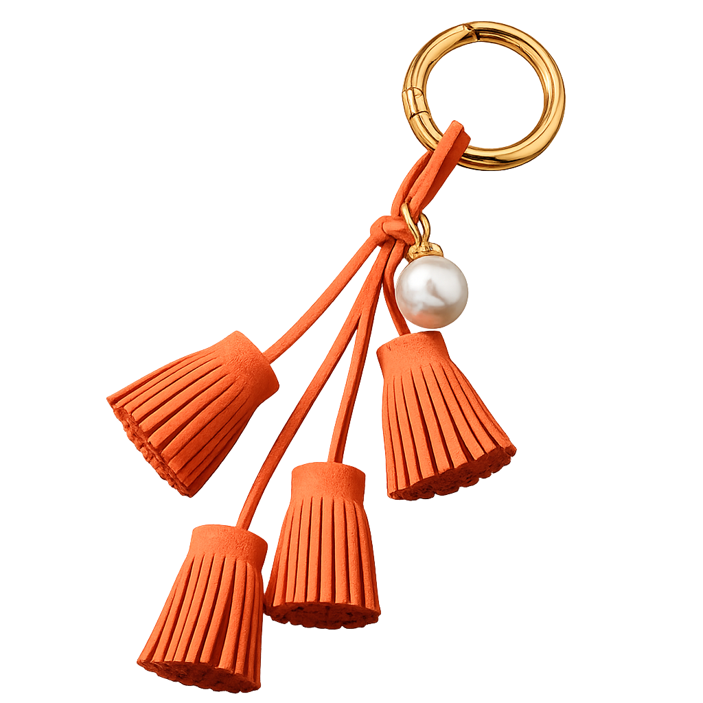 Orange Suede & Pearl Tassel Bag Charm with pearl accent on brass key ring. 