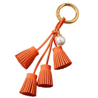 Orange Suede & Pearl Tassel Bag Charm with pearl accent on brass key ring. 