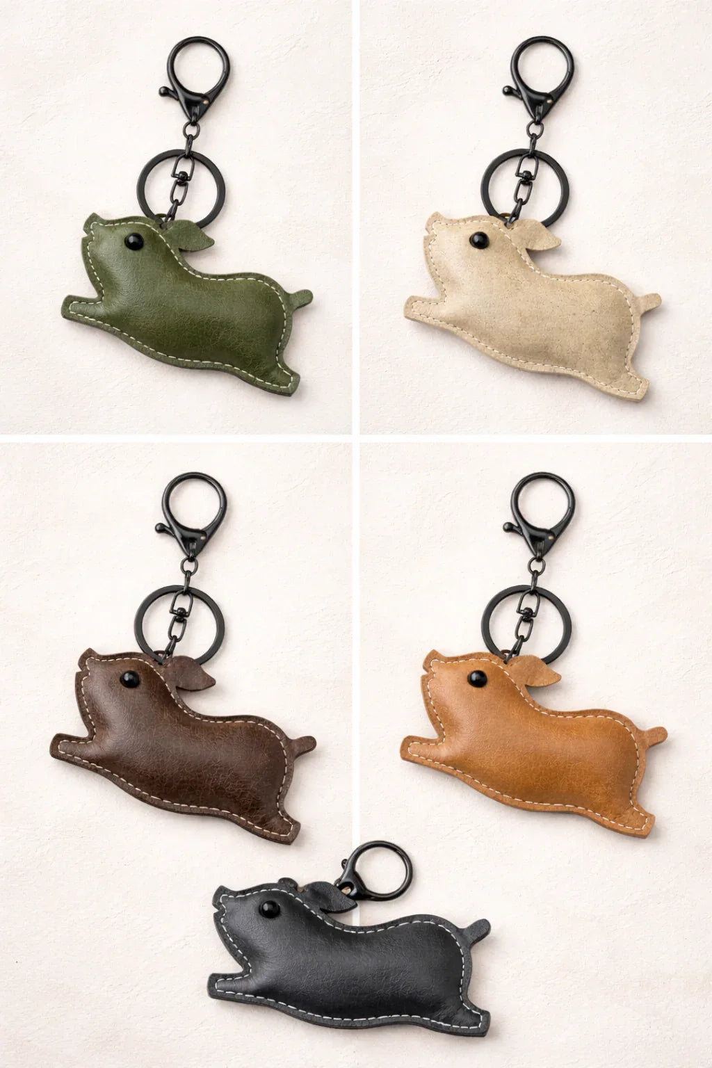 5  Leather Pig Key Chain and Bag Charm with Key ring and clasp on table 