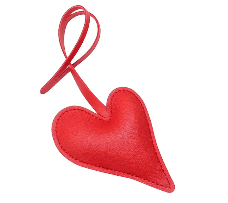 Red Carry Your Heart Collection Leather Heart Bag Charm on white background. 
