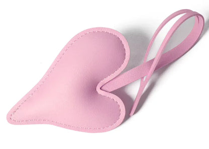 Pink Carry Your Heart Collection Leather Heart Bag Charm on white background. 