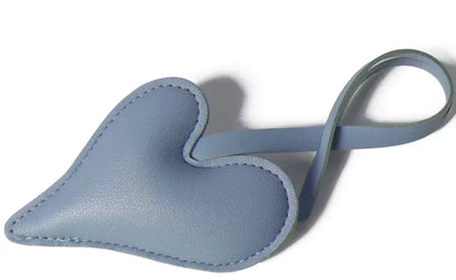 Lavender Carry Your Heart Collection Leather Heart Bag Charm on white background. 