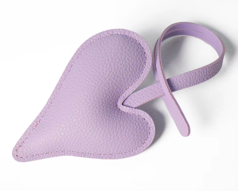 Lavender  Carry Your Heart Collection Leather Heart Bag Charm on white background. 