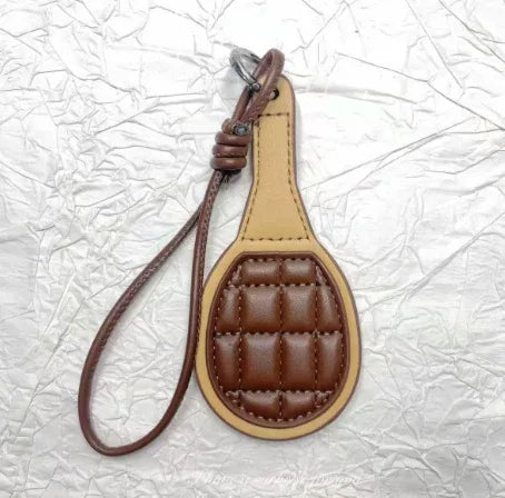 Brown pickle ball paddle Bag Charm.