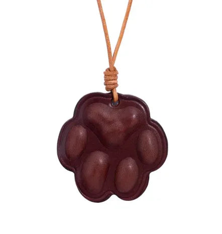 Everyday Companion Merlot Dog Paw Bag Charm  with leather strap. 