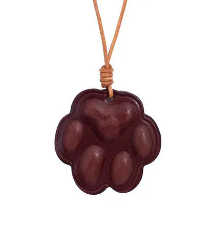 Everyday Companion Merlot Dog Paw Bag Charm  with leather strap. 