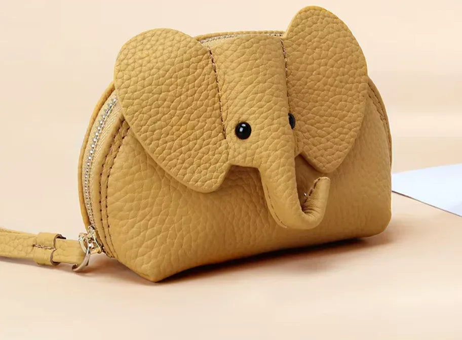 Baby Elephants on Parade genuine leather elephant-shaped coin pouch in Yellow.