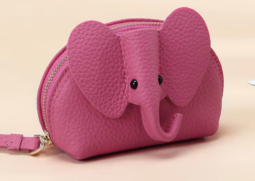 Baby Elephants on Parade genuine leather elephant-shaped coin pouch in Pink.