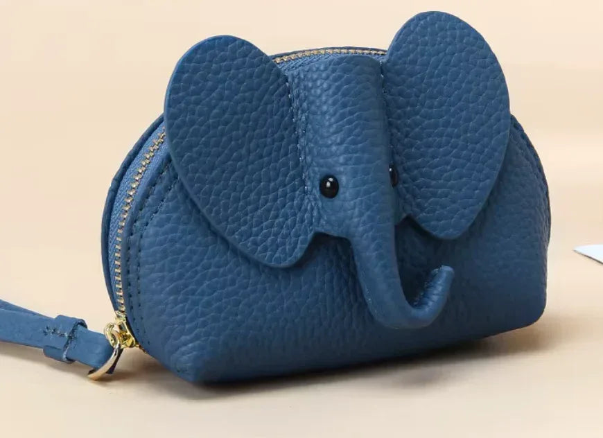 Baby Elephants on Parade genuine leather elephant-shaped coin pouch in Blue.