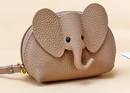 Baby Elephants on Parade genuine leather elephant-shaped coin pouch in Tan.