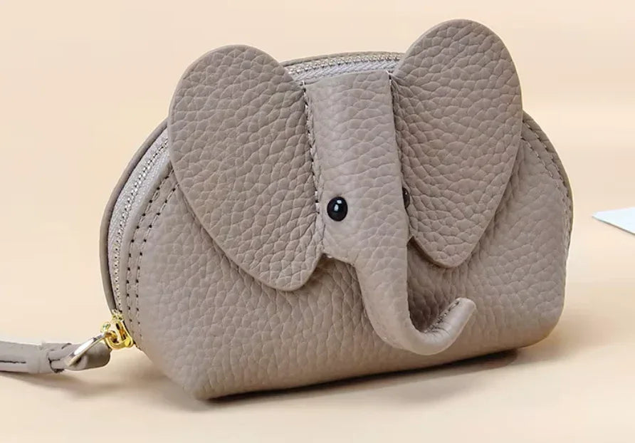 Baby Elephants on Parade genuine leather elephant-shaped coin pouch in Grey.