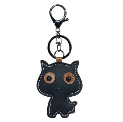 Black handmade leather cat keychain with a minimalist silhouette and silver metal key ring.