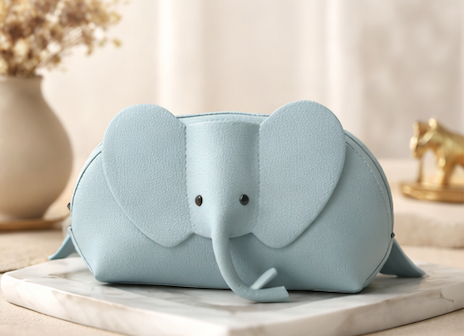 Handcrafted genuine leather elephant crossbody mini bag in purple by Trunk Love.