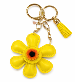Handmade yellow leather daisy keychain with yellow center and gold clasp.