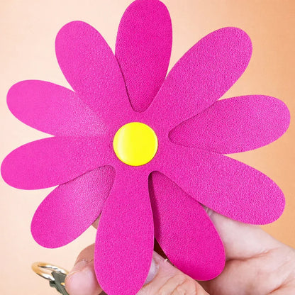 Close up of a pink Petal Pop Bag charm to show size and detail. 