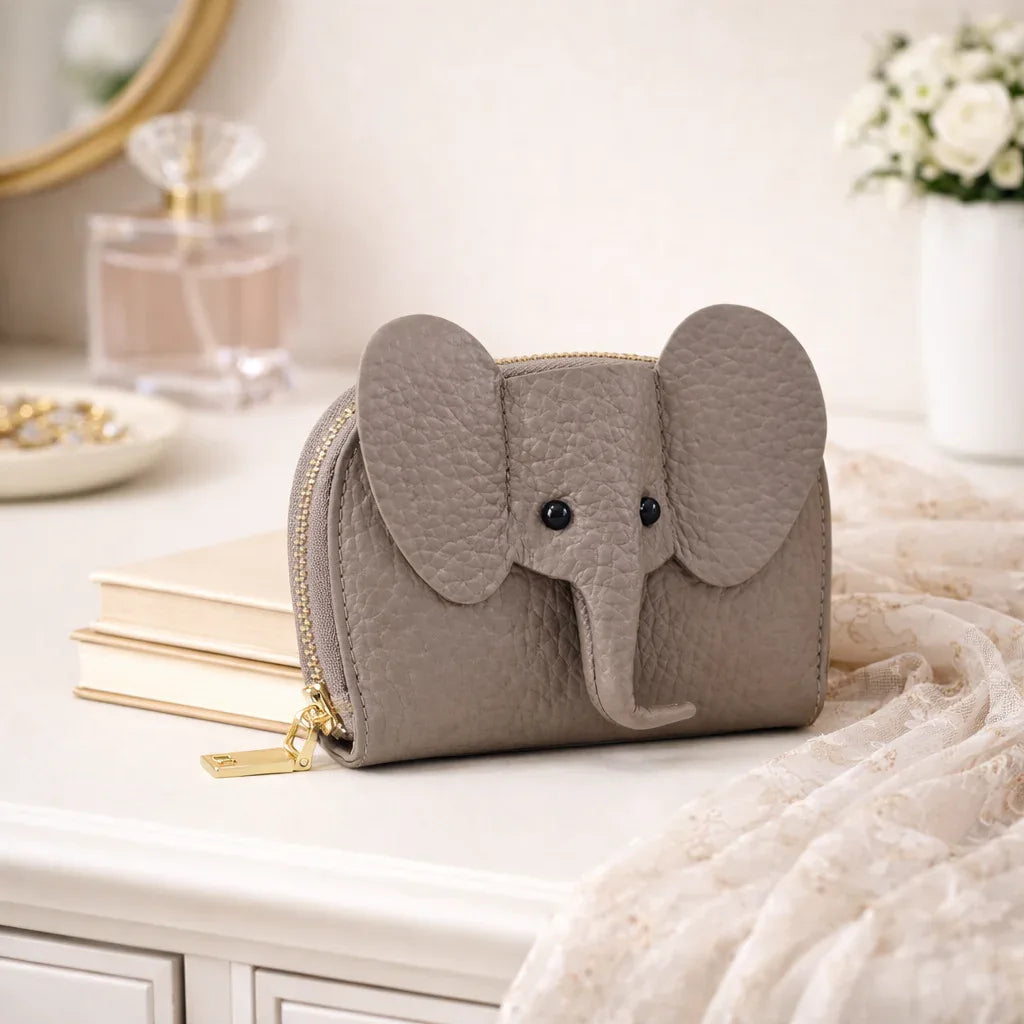 Elephant-shaped leather card holder in Grey with a secure gold zipper and multiple card slots.