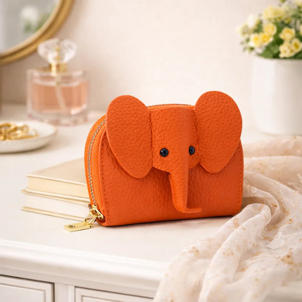 Elephant-shaped leather card holder in Orange with a secure gold zipper and multiple card slots.