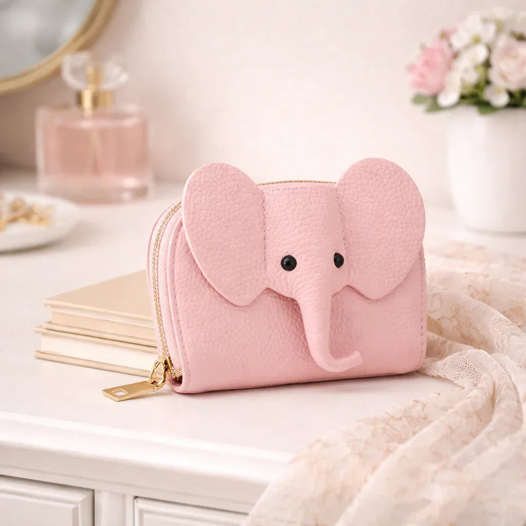 Elephant-shaped leather card holder in Pink with a secure gold zipper and multiple card slots.