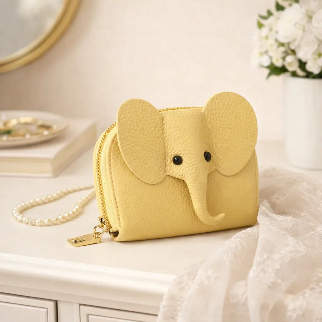 Elephant-shaped leather card holder in Yellow with a secure gold zipper and multiple card slots.